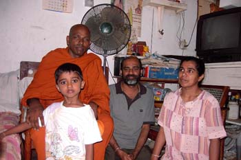 2004 December with Mr Bandara and family in Tambuttegama