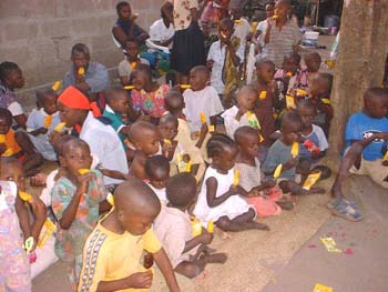2005 Giving food for orphans in Tanzania (1)