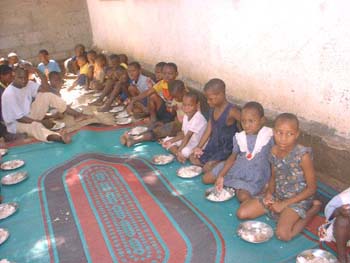 2005 Giving food for orphans in Tanzania