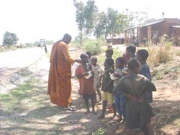 Giving bread to some children