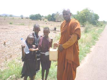 Giving water for Masai people