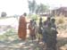 Giving bread to some children
