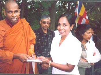 2003 - Gave a book to mrs Shanthinie at sinsinati temple in USA
