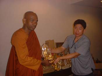 International Vesak day in Thiland 2006 - offering Buddha's statues